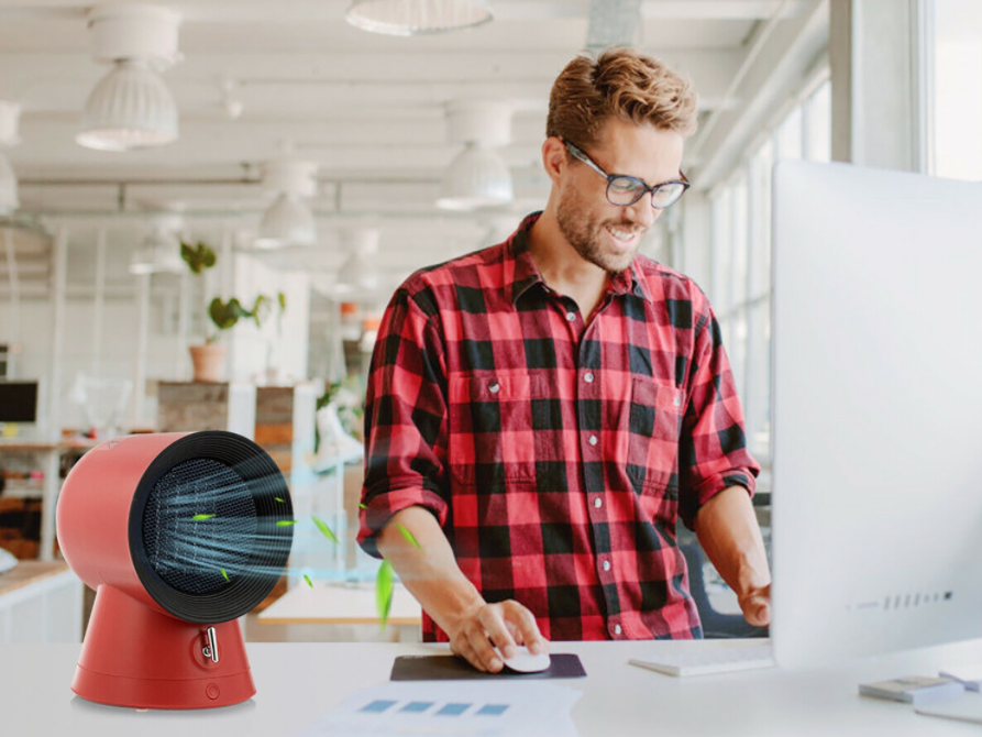 Costway desktop space heater with a man at a computer.