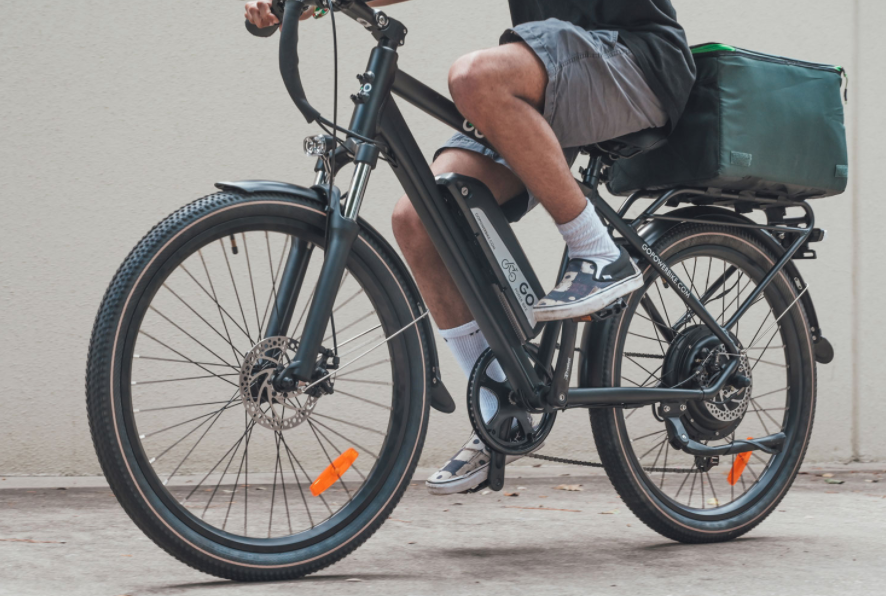 A mans legs riding an ebike