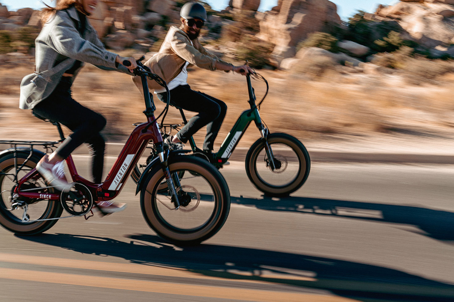 Two people riding Aventon electric bikes