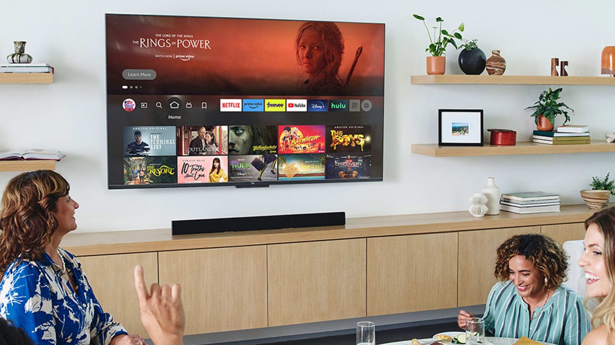 Wall Mounted TV being watched by people around a table at different angles and heights
