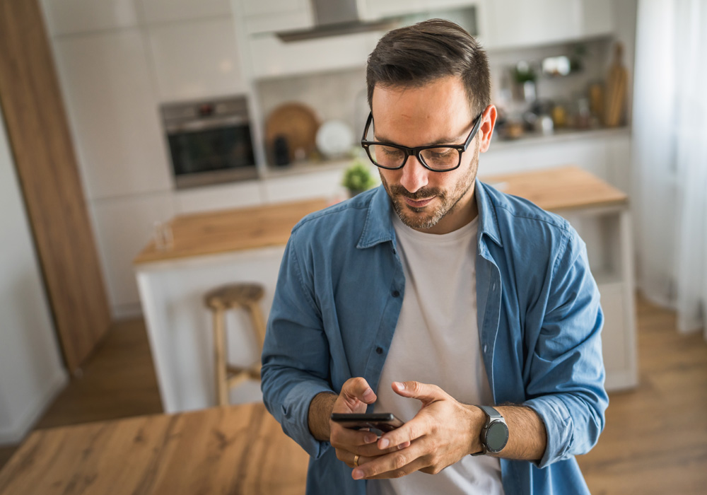 A man typing on his phone.