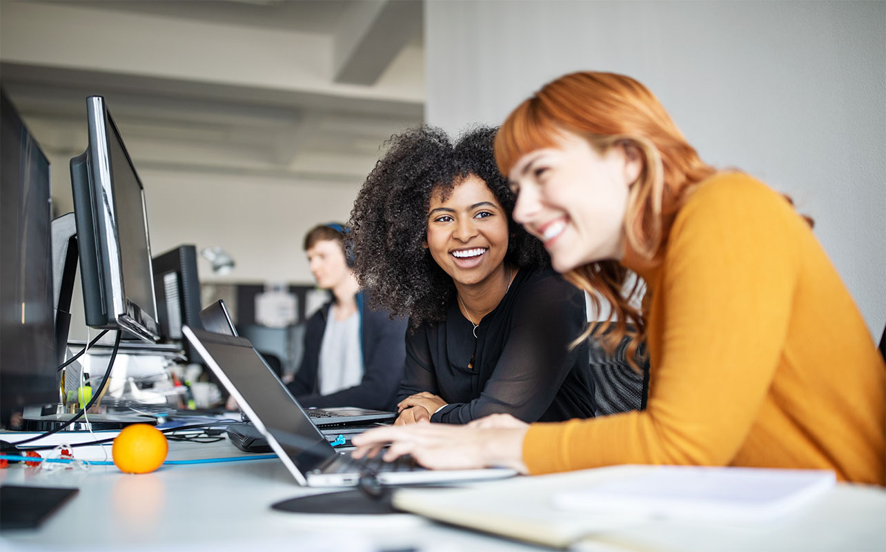 Girls using laptops for work